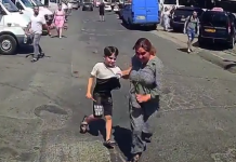 (видео) Женщина с ребёнком пыталась инсценировать ДТП, бросившись на капот автомобиля